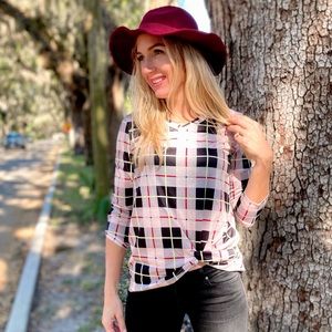 Beautiful long sleeve tee with a fun twist knot in the front